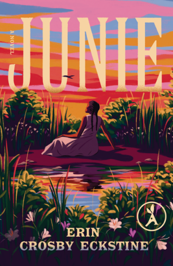 Woman in white dress sitting by water surrounded by tall plants at sunset, book cover titled Junie.